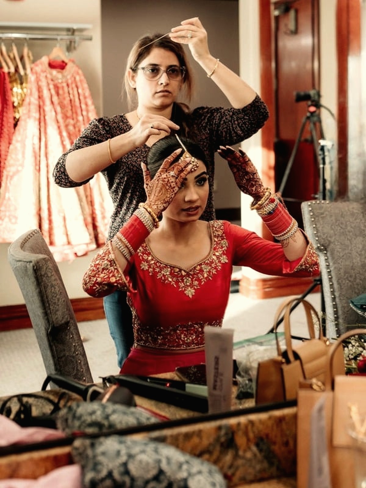 A Rozina's stylist preparing a bride — hair and finishing touches